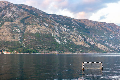 Water polo gate in the bay . sea with mountains background . water sports concept