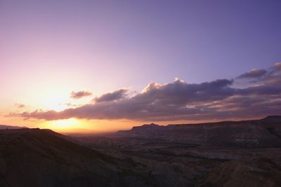 Scenic view of landscape against sky during sunset