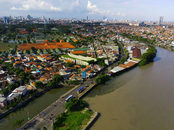 High angle view of river amidst buildings in city