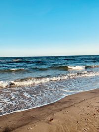 Scenic view of beach against clear sky