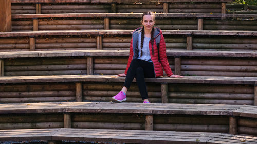 Full length of woman standing on staircase