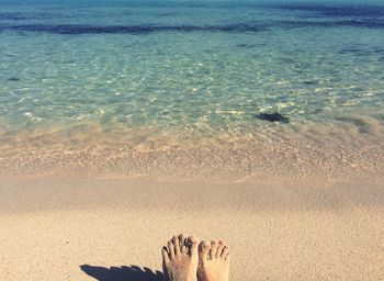 Low section of woman on beach