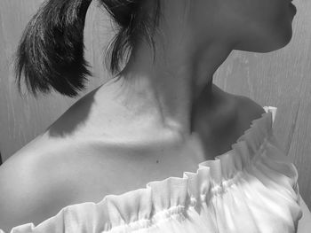 Midsection of woman wearing off shoulder top