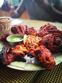 Close-up of fried chicken served in plate on table