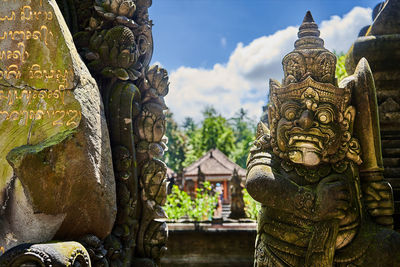 Statue of temple against building