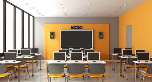 Empty chairs in classroom