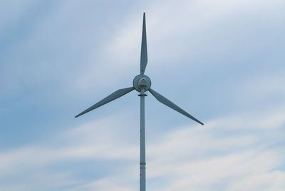 Low angle view of wind turbine against sky