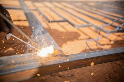 High angle view of fire burning on wood