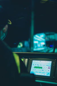 Man seen through car windshield at night