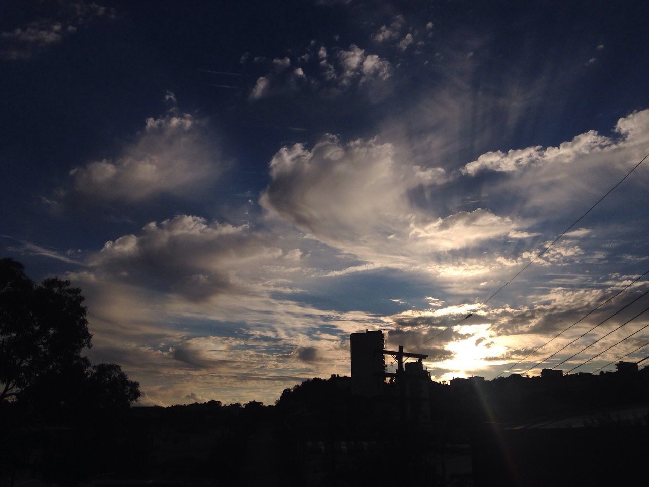 SILHOUETTE OF BUILT STRUCTURE AT SUNSET