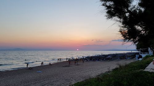 Scenic view of beach against sky during sunset