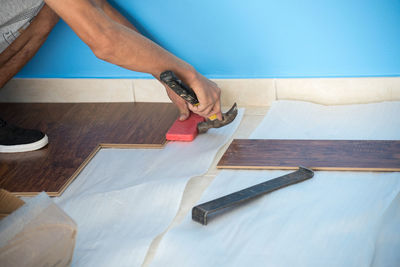 High angle view of man working on table at home