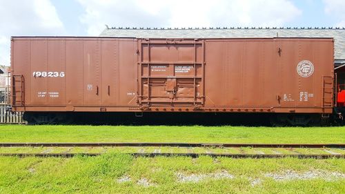 Train on field against sky