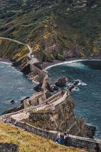 High angle view of rocks by sea against sky