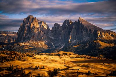Sassolungo mountain above high plateau of alpe di siusi in val gardena, south tyrol, italy in autumn