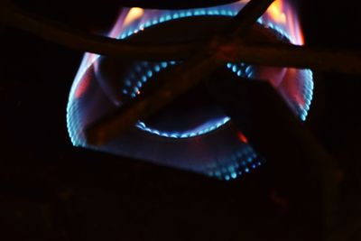 Close-up of hand holding illuminated lamp