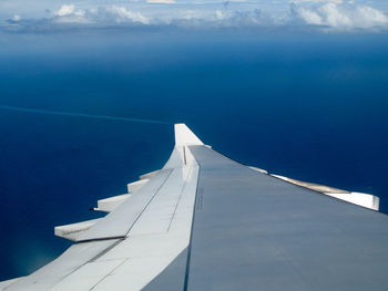 Low angle view of sea against blue sky