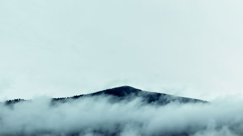 Scenic view of mountains against sky during winter