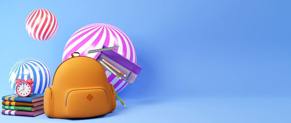 Multi colored umbrella against blue sky