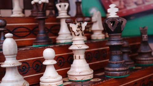 Close-up of chess pieces on table