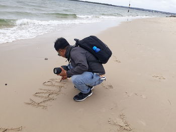 Full length of man on beach