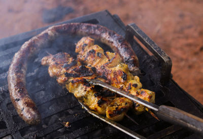 Sosaties on a braaier during a braai 