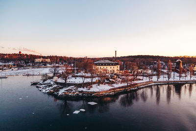 Panoramic view of river and buildings against sky