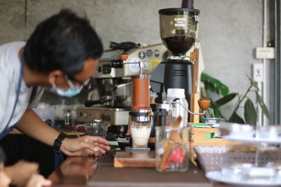 Man preparing food in glass