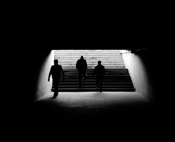 Silhouette people in corridor