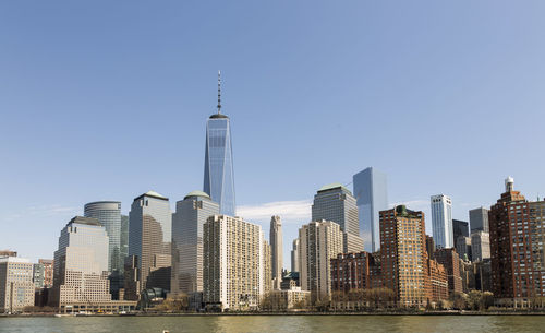 Modern buildings in city against clear sky