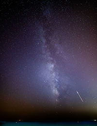 Scenic view of star field against sky at night