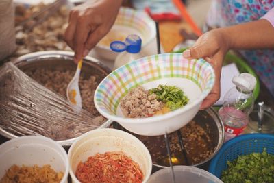 High angle view of woman preparing food on table