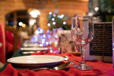 Close-up of wine glasses on table in restaurant