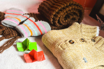 Close-up of multi colored warm clothing on table