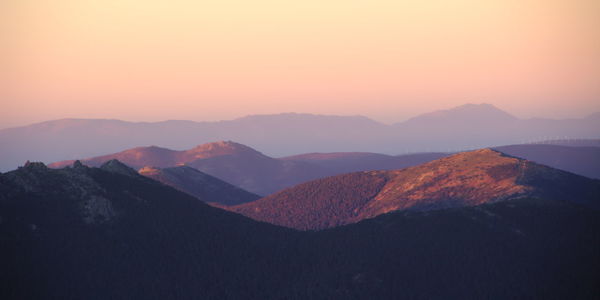 Scenic view of mountains against sky during sunset