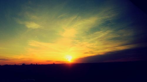 Scenic view of silhouette landscape against sky during sunset