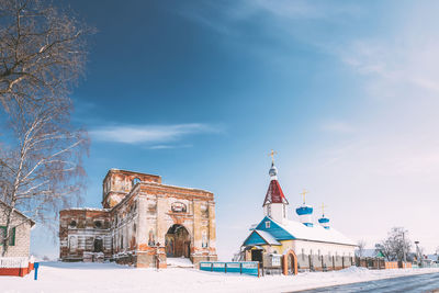 Traditional building against sky during winter