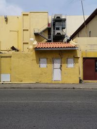 Yellow building against sky