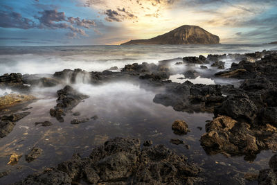 Scenic view of sea against sky during sunset