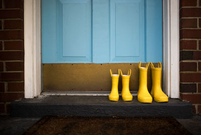 Yellow closed door of building