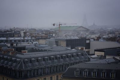 High angle view of buildings in city against sky