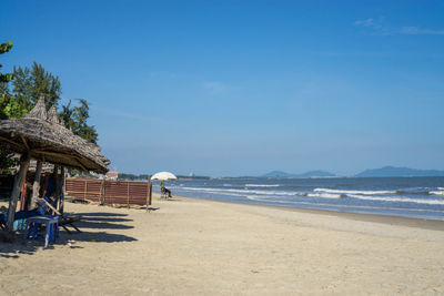 Beachfront bar view in vung tau, vietnam with blue sky and sea waves in the background