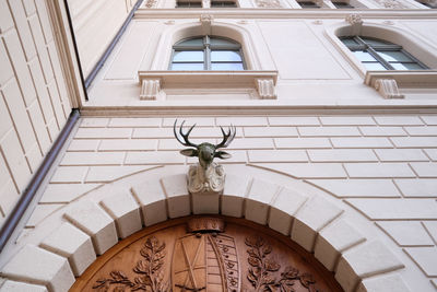 Low angle view of statue against building