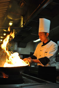 Man working in kitchen at restaurant