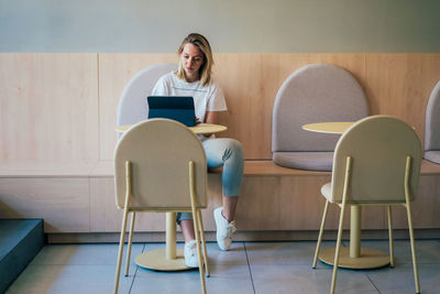 Man sitting on chair at home