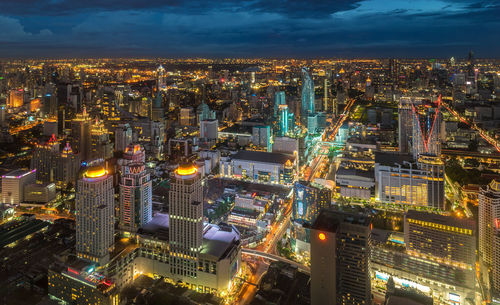 High angle view of illuminated city buildings at night