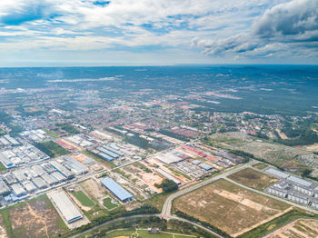 Aerial view of cityscape against sky