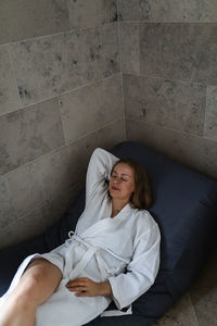 High angle view of woman relaxing on bean bag