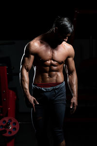 Rear view of man standing in gym