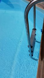 High angle view of metal ladder in swimming pool